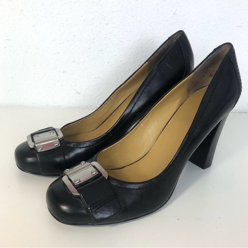 Nine West black heels with silver buckle.
